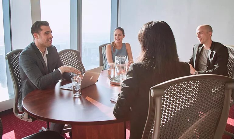 Meeting room at River Point, Chicago, with clients enjoying flexible setups in a prestigious location.