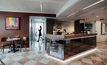 Receptionist helping clients at the front desk